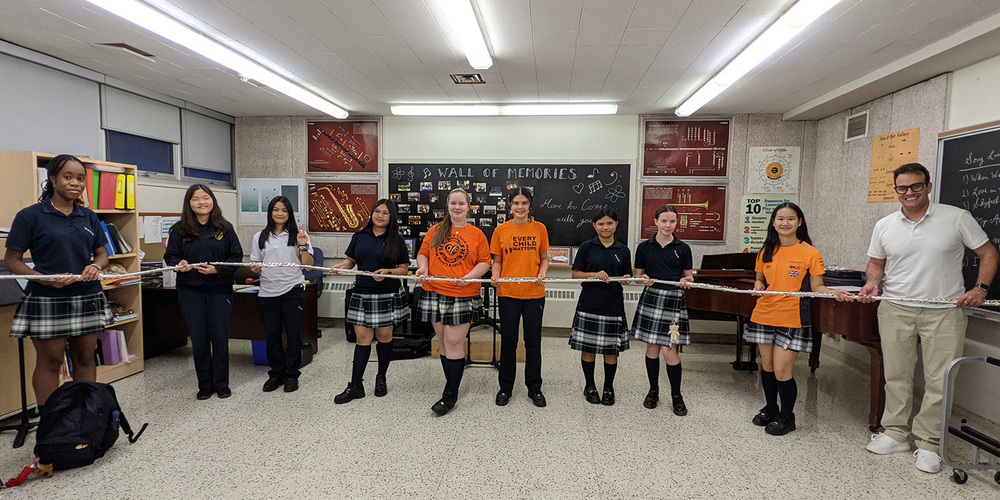 Group photo of SJCS students holding their flutes
