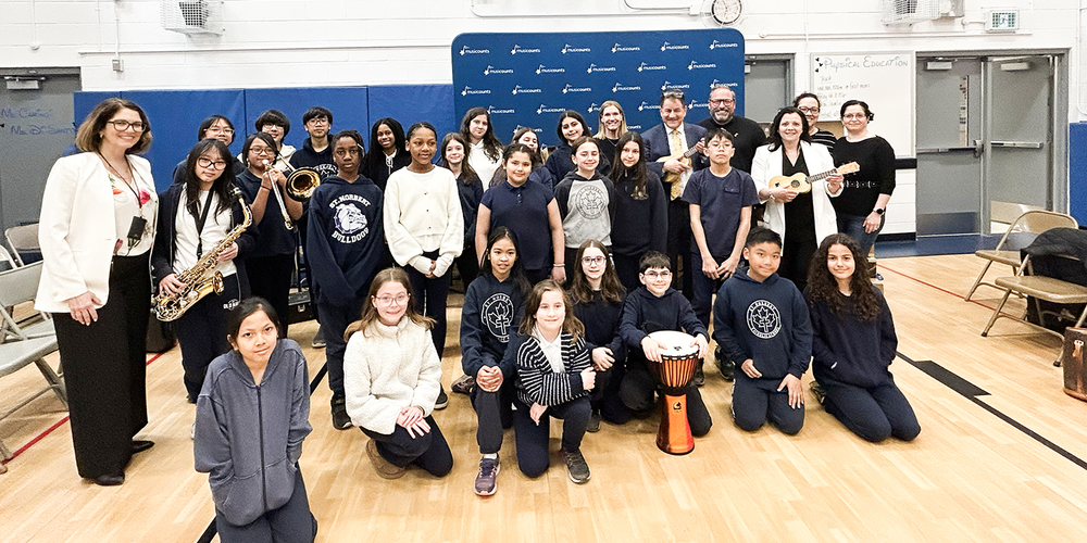 Photo of St. Norbert students and staff with the donated musical instruments