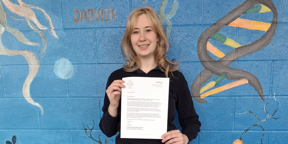 Photo of Sonya with her letter of award