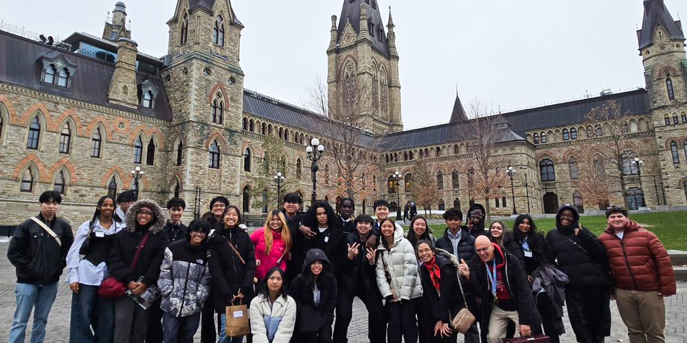 Group photo of St. Oscar Romero students and staff in front of the Canadian parliament