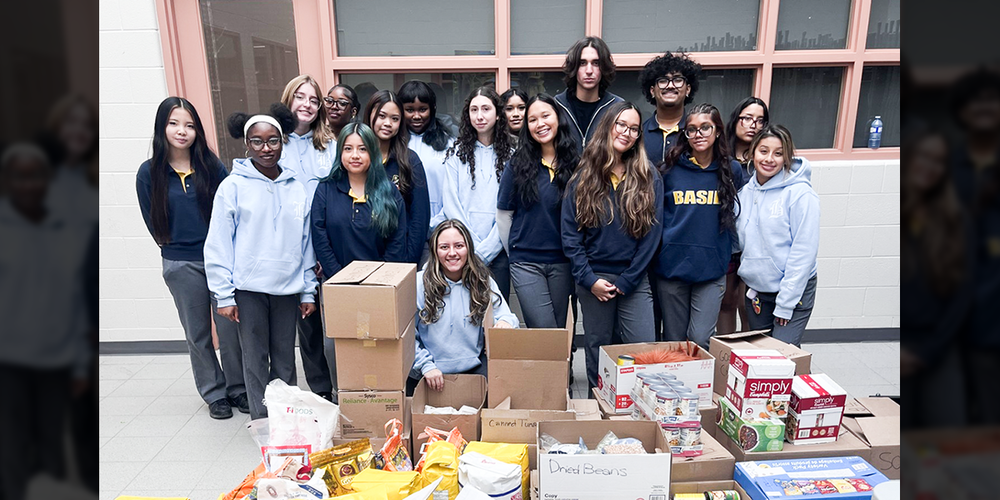 Group photo of St. Basil-the-Great College School's leadership students with the boxes of food that they collected for the drive