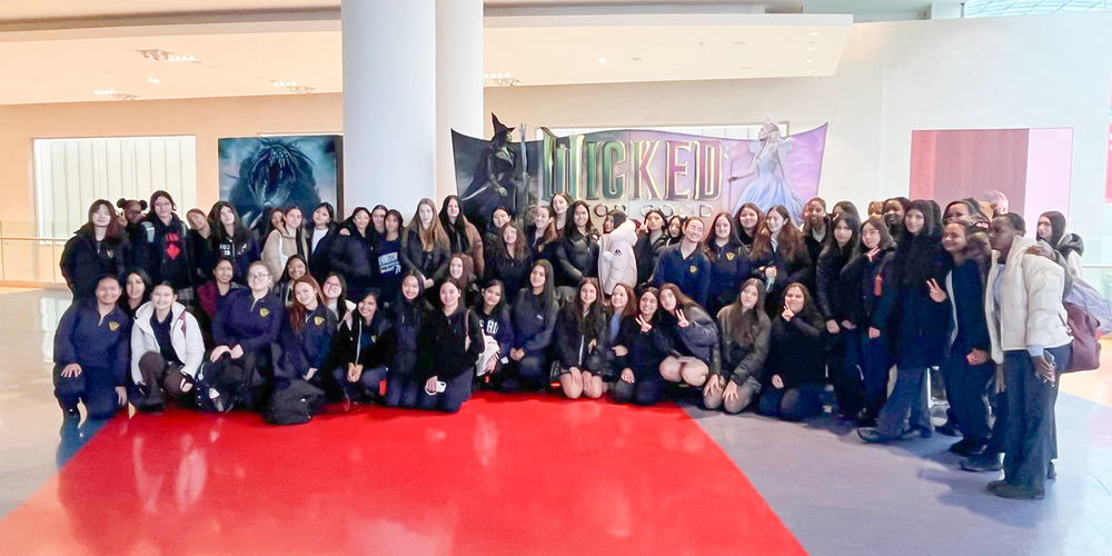 Group photo of Loretto College students and staff before the Wicked: For Good screening