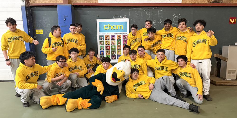 Group photo of Chaminade students along with the school mascot at the retreat