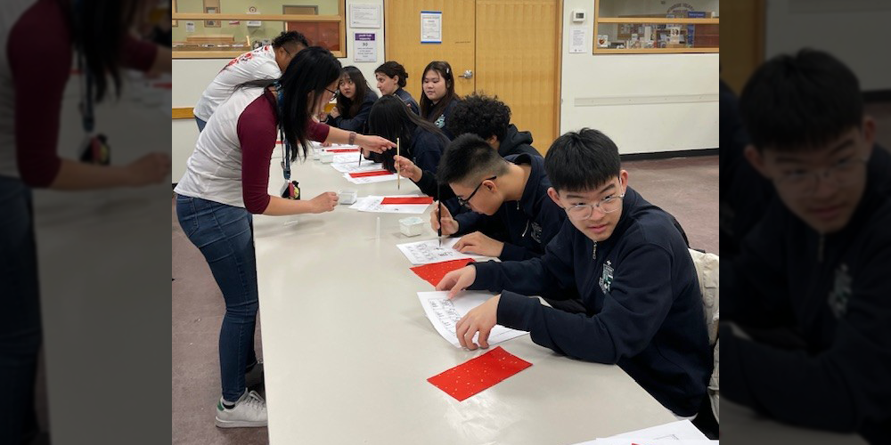 Photo of Libermann students working on their calligraphy