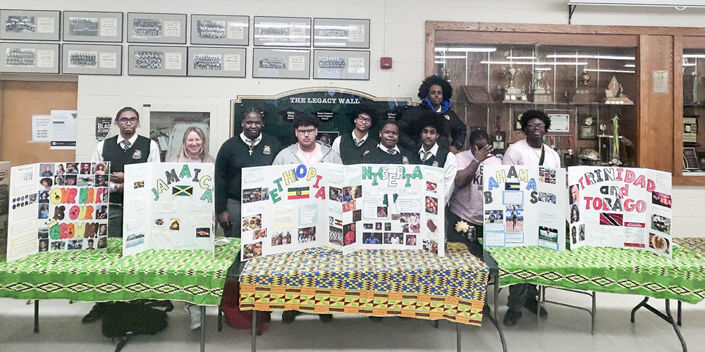 Photo of Chaminade students with their presentations