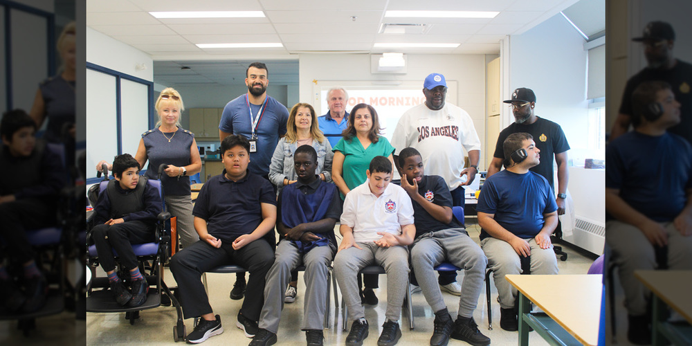 Group photo of Father Henry Carr ISP students and staff in a newly renovated classroom