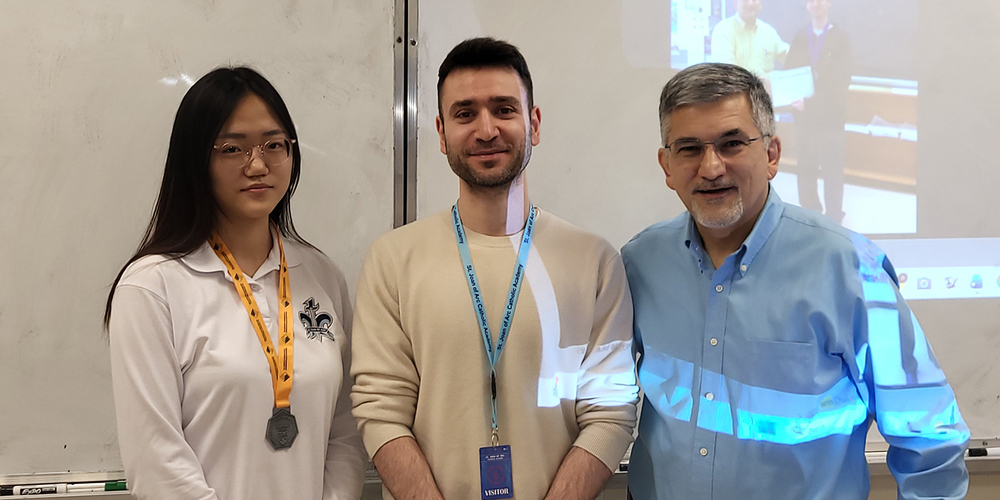 Photo of Suyeon wearing her medal, along with Yamn and Mr. Raymond Sarkissian