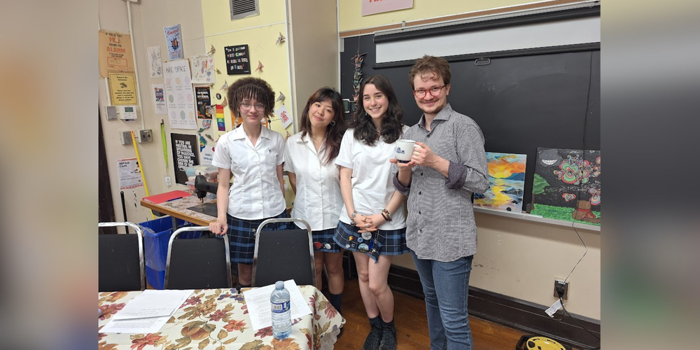 3 students and 1 faculty in a classroom