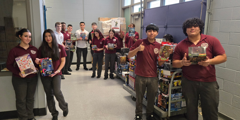 Students posing with toys
