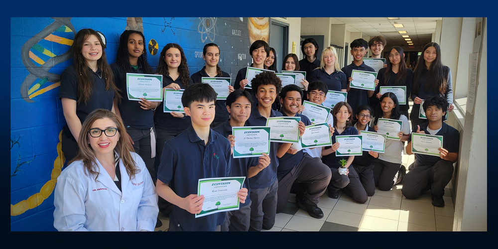 Photo of Marshall McLuhan students holding their certificates, along with their teacher