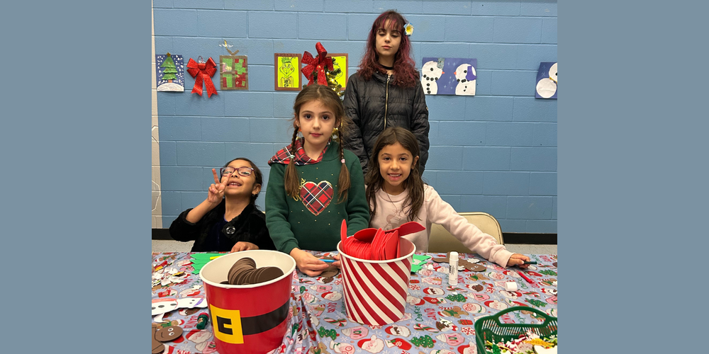 Kids sitting at a Christmas themed table