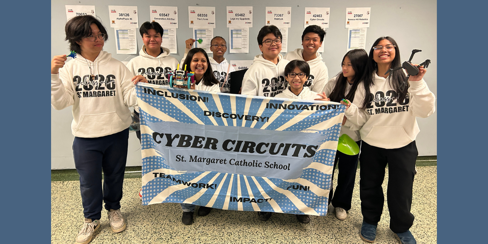 Students posing in St. Margaret sweaters while holding a CYBER CIRCUITS banner