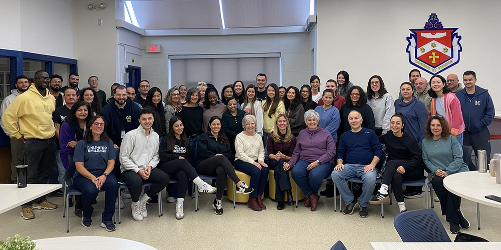 Group photo of Father Henry Carr staff