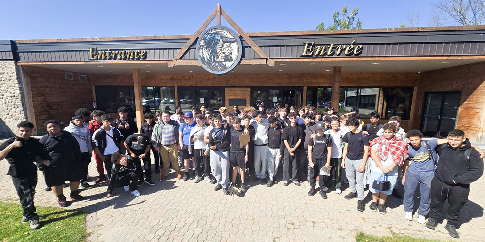Group photo of Chaminade Students in front of the entrance
