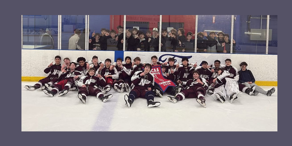 Hockey team posing on the ice 