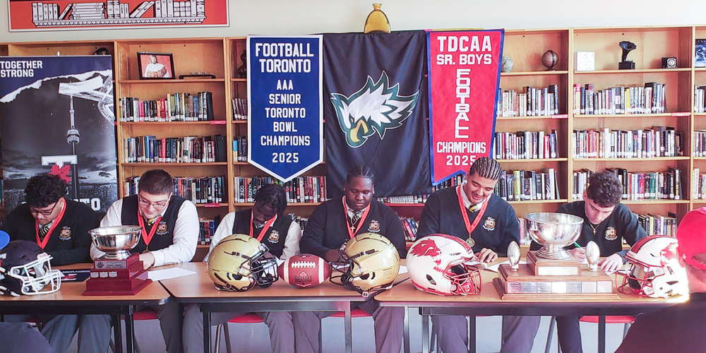 Photo of Chaminade students signing their letters of intent