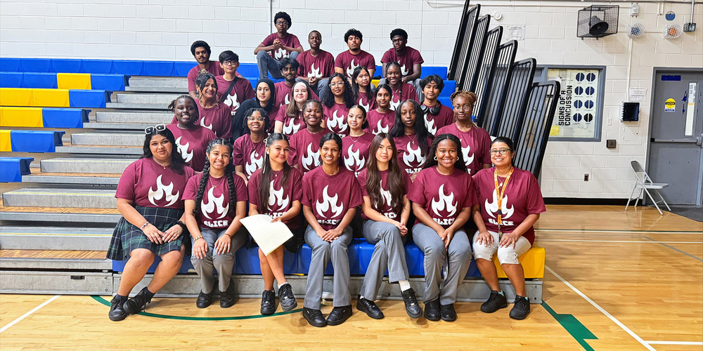 Group photo of St. Mother Teresa Catholic Academy's SLICE (Student Leaders in Catholic Education) Committee wearing their committee shirts