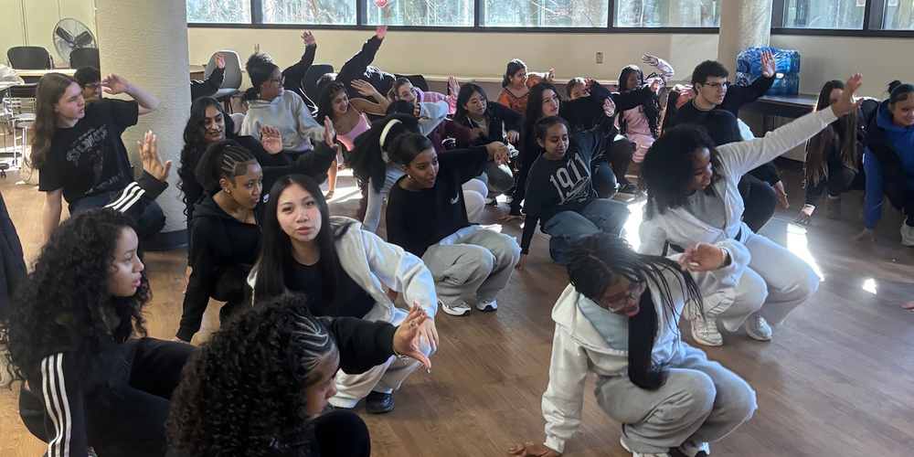 Photo of Newman students breakdancing during the session