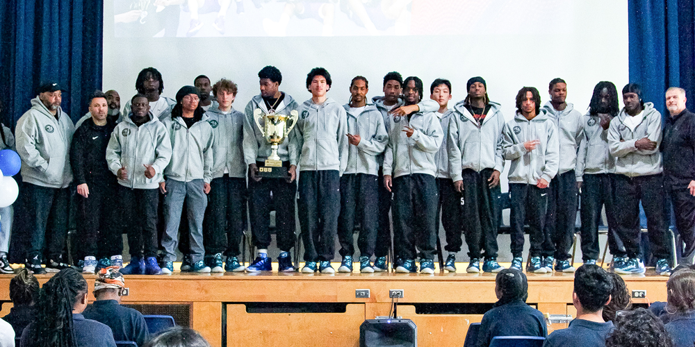 Group photo of the Senior Prep Basketball team with their trophy