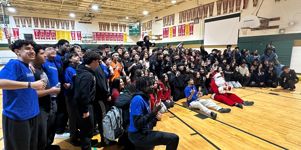 Large group of students posing in a gym