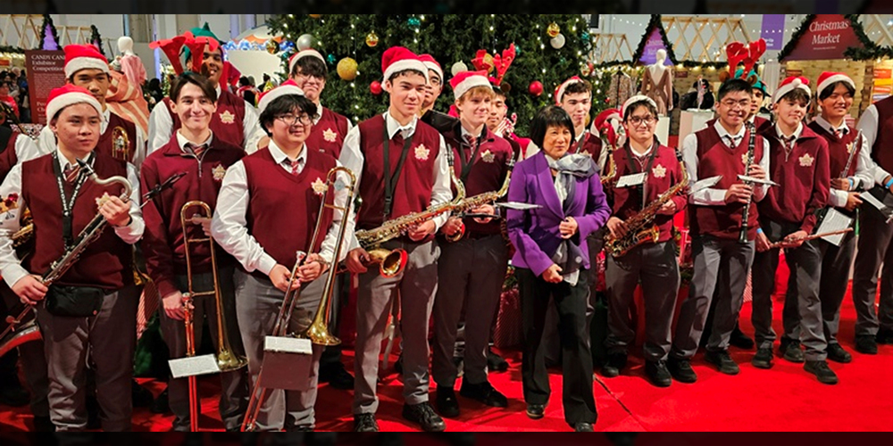 Group photo of Neil McNeil Marching Band students with Mayor Olivia Chow