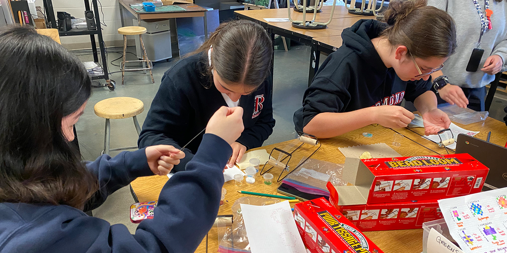 Photo of students working on their beading
