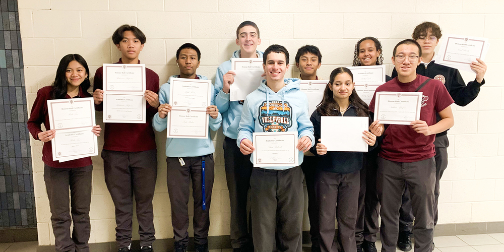 Group photo of St. Oscar Romero students with their achievement certificates