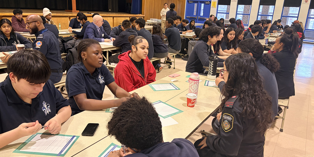 Photo of SJOA students conversing with coaches during the event
