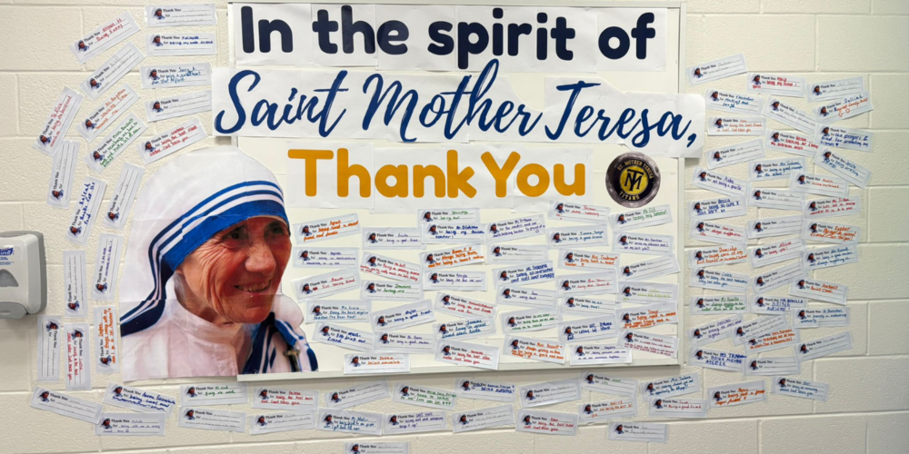 "In the spirit of Saint Mother Teresa Thank You" banner on a wall with notes around it. 