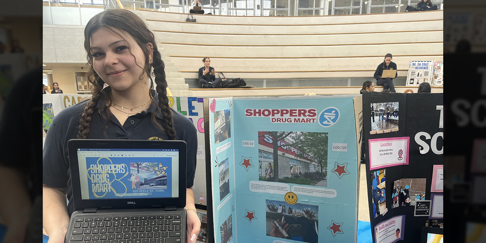 Photo of student at the fair with her presentation on her co-op experience at Shoppers Drug Mart