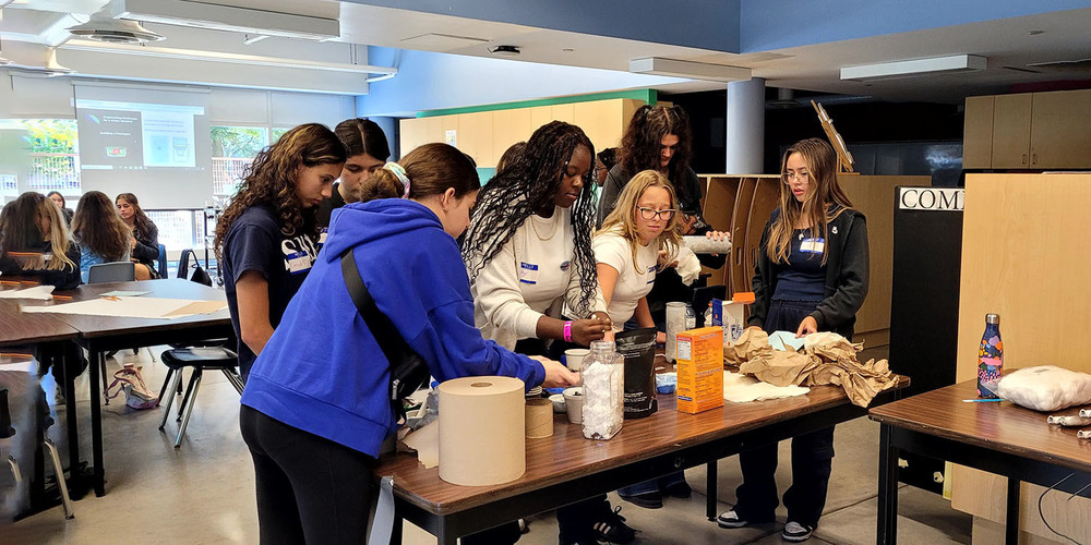 Photo of Loretto College School students working together in the lab on a science experiment