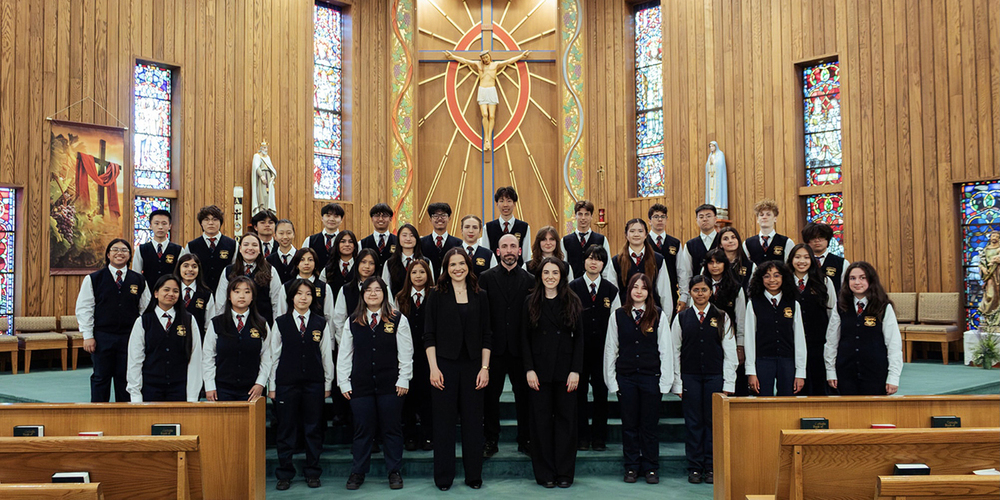 Group photo of CCAA students and staff in the Church for the recording