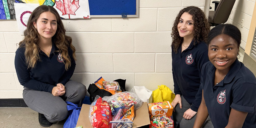 Photo of Redmond students with the boxes of candy they collected