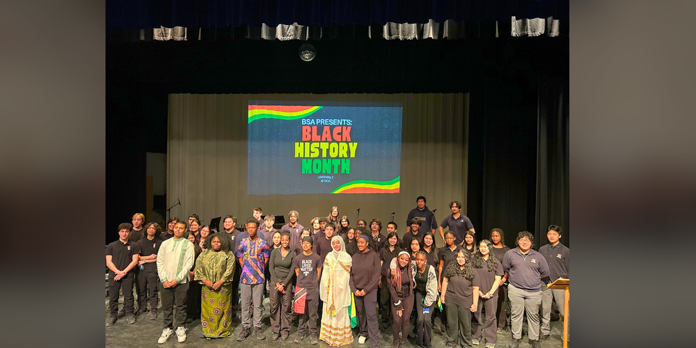 Large group of students on a stage for Black History Month