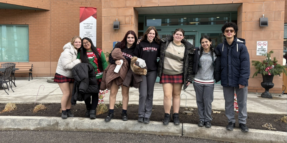 7 students posing outside in the winter