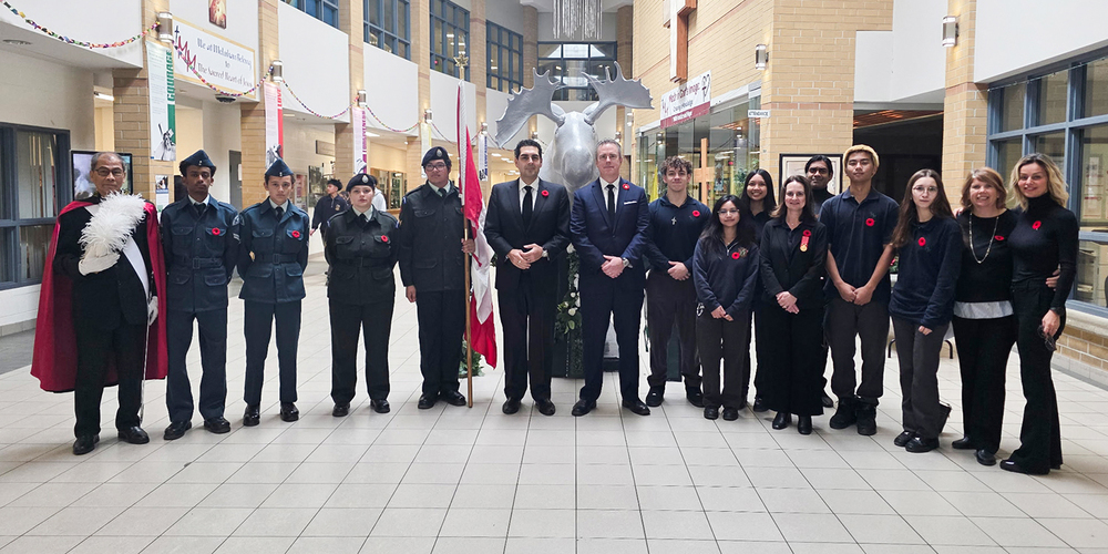 Group photo of Marshall McLuhan students with honoured guests Mr. Vince Gasparro, Member of Parliament for the riding of Eglinton-Lawrence, Ms. Nina Hollington, the school's music teacher and Captain Retired, and Mr. Silverio Dulay, the school's caretaker and a member of the Order of the Knights of Columbus at Our Lady of Assumption Church, Council 12582