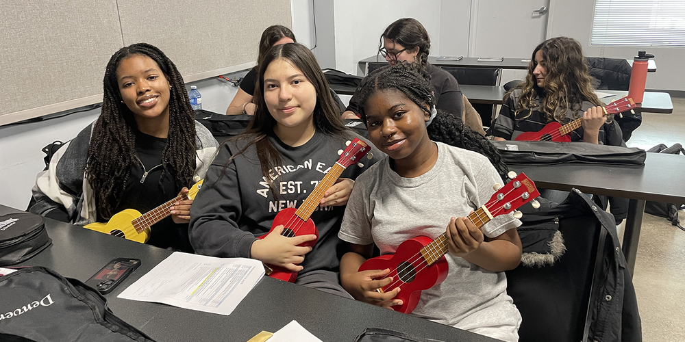 Photo of Loretto College students playing ukulele at the Music Care Conference