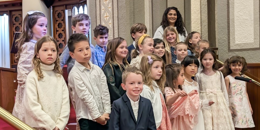 Photo of Our Lady of Perpetual Help students at the Parish with their teacher