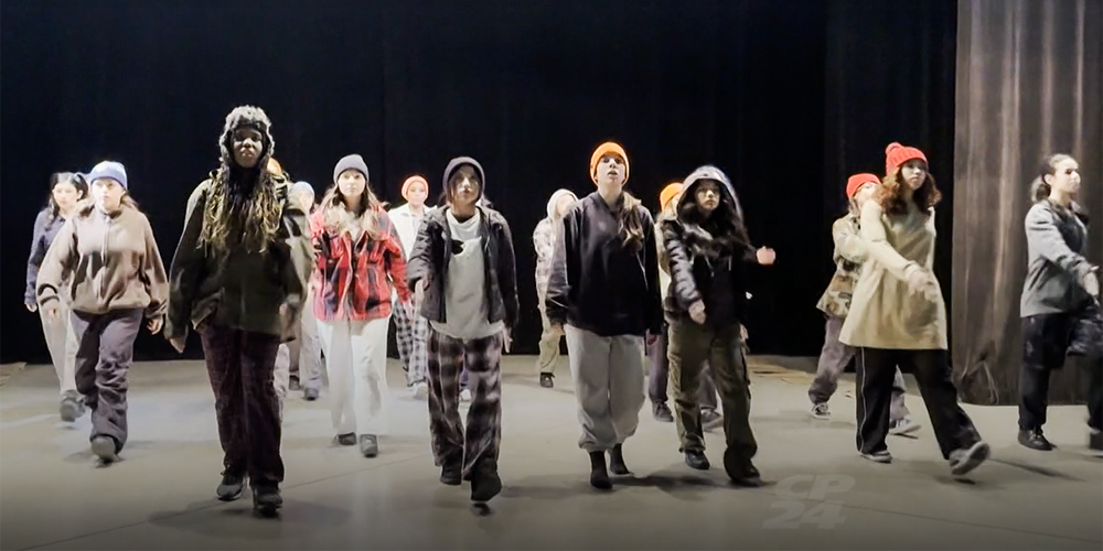 Photo of students dancing on stage