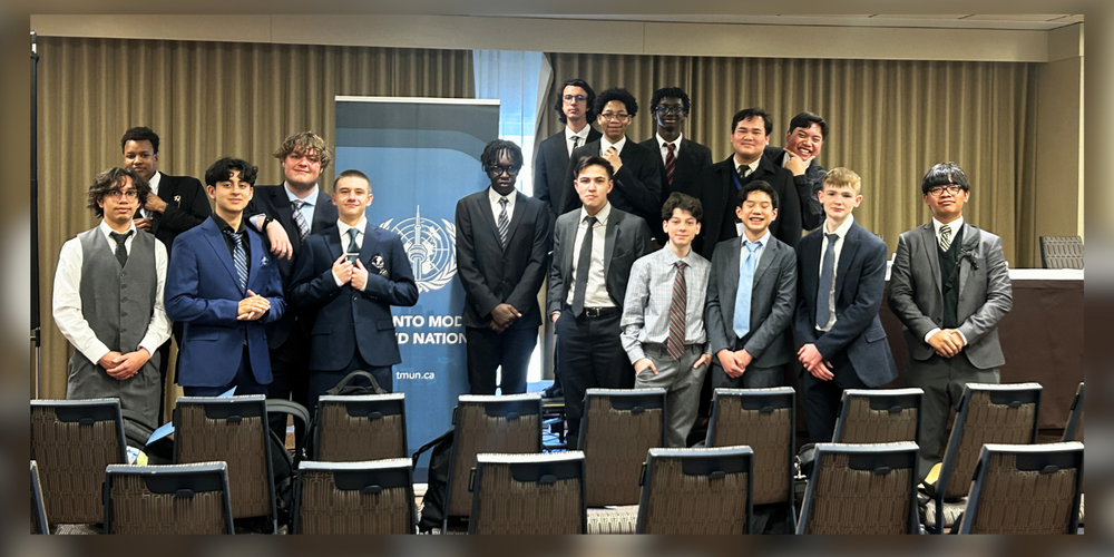 Group of young male students dressed in business attire