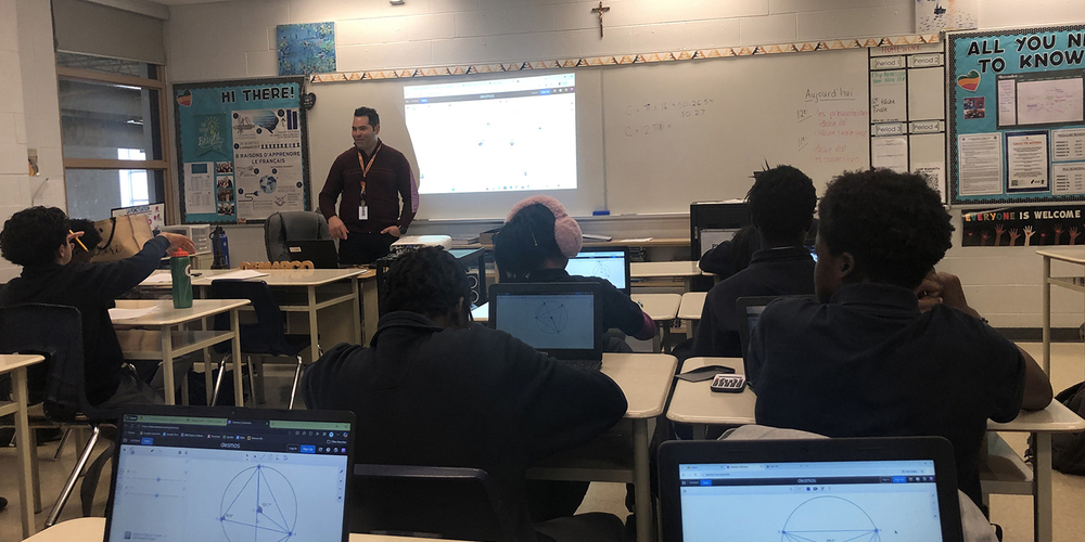 Photo of Father Henry Carr students working on the sessions in math class