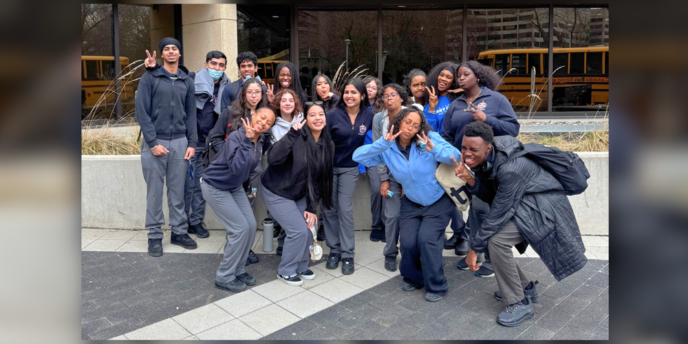 A group of students in uniform outdoors.