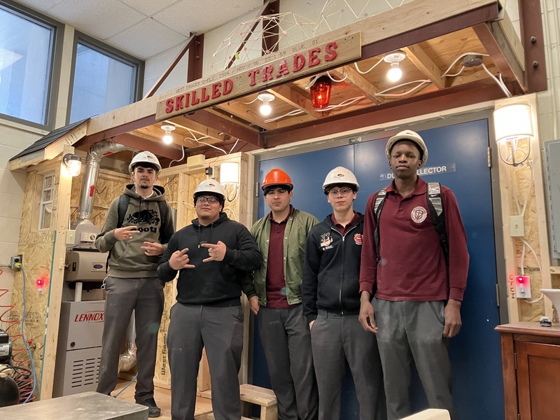 Pictured from left to right are Afonso F., Edgar D., Kevin G., Emilliano R., and Agustin N. standing inside their fully electrified mock-up.