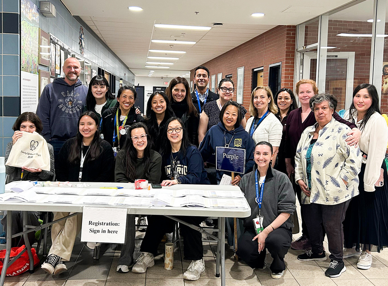 Group photo of Our Lady of Lourdes staff and community members at the event