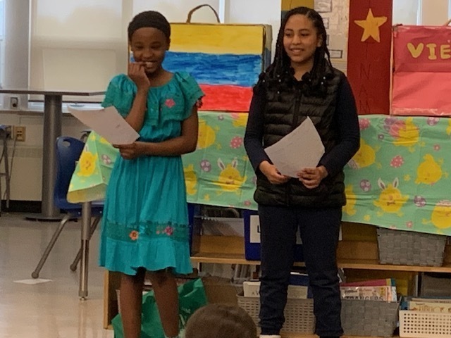 Photo of students presenting the display they created