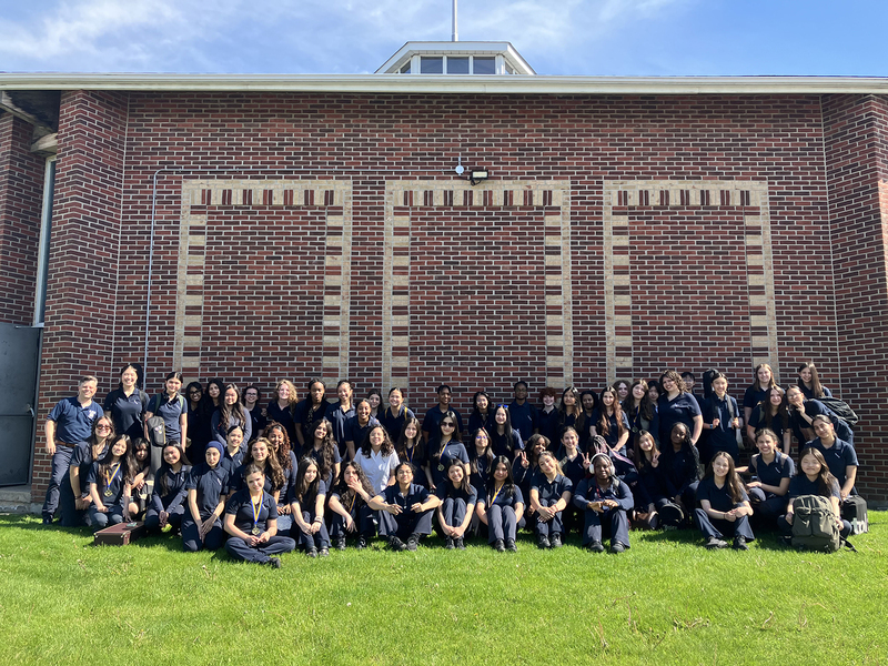 Group photo of SJCS music students in their uniforms during the excursion