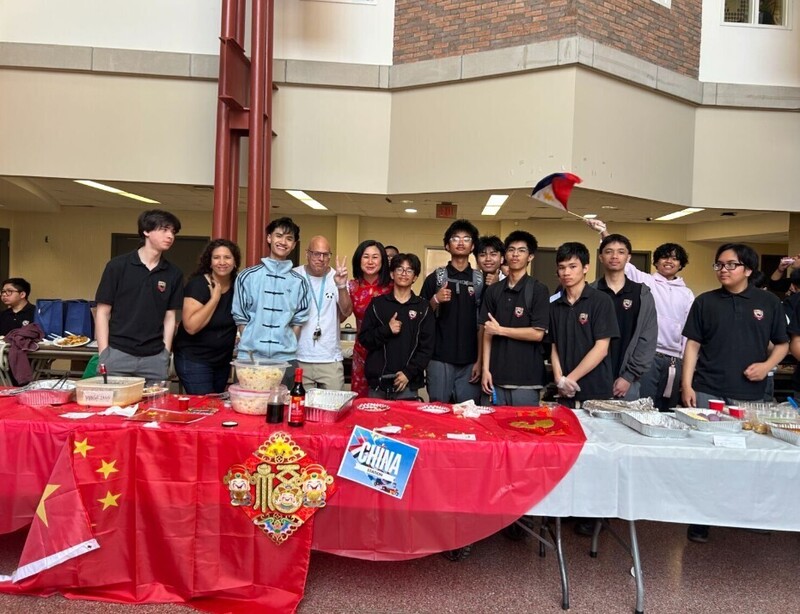 Photos of cultural food table set up by Brebeuf students, showcasing food from the cultural region and countries from that culture and region