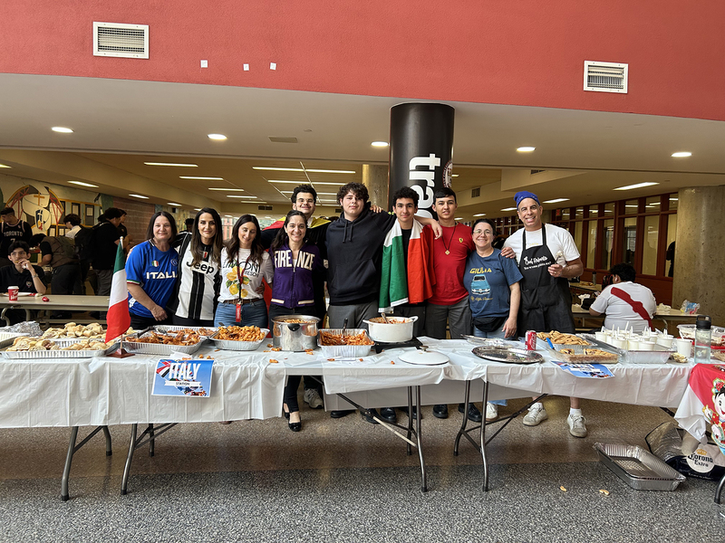 Photos of cultural food table set up by Brebeuf students, showcasing food from the cultural region and countries from that culture and region