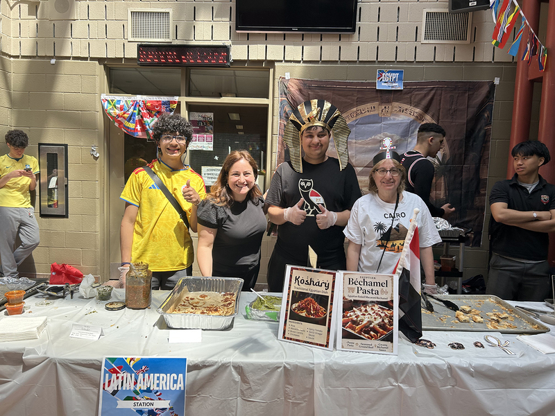 Photos of cultural food table set up by Brebeuf students, showcasing food from the cultural region and countries from that culture and region