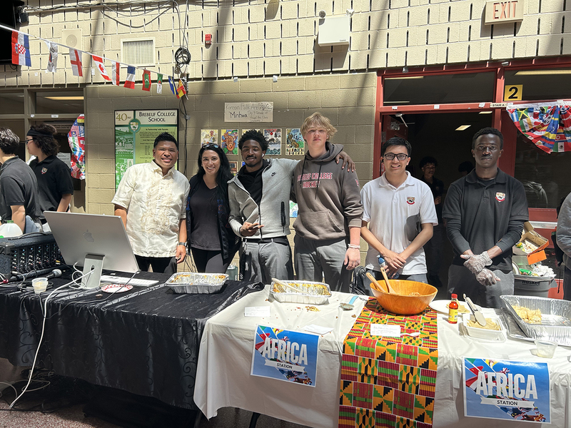 Photos of cultural food table set up by Brebeuf students, showcasing food from the cultural region and countries from that culture and region